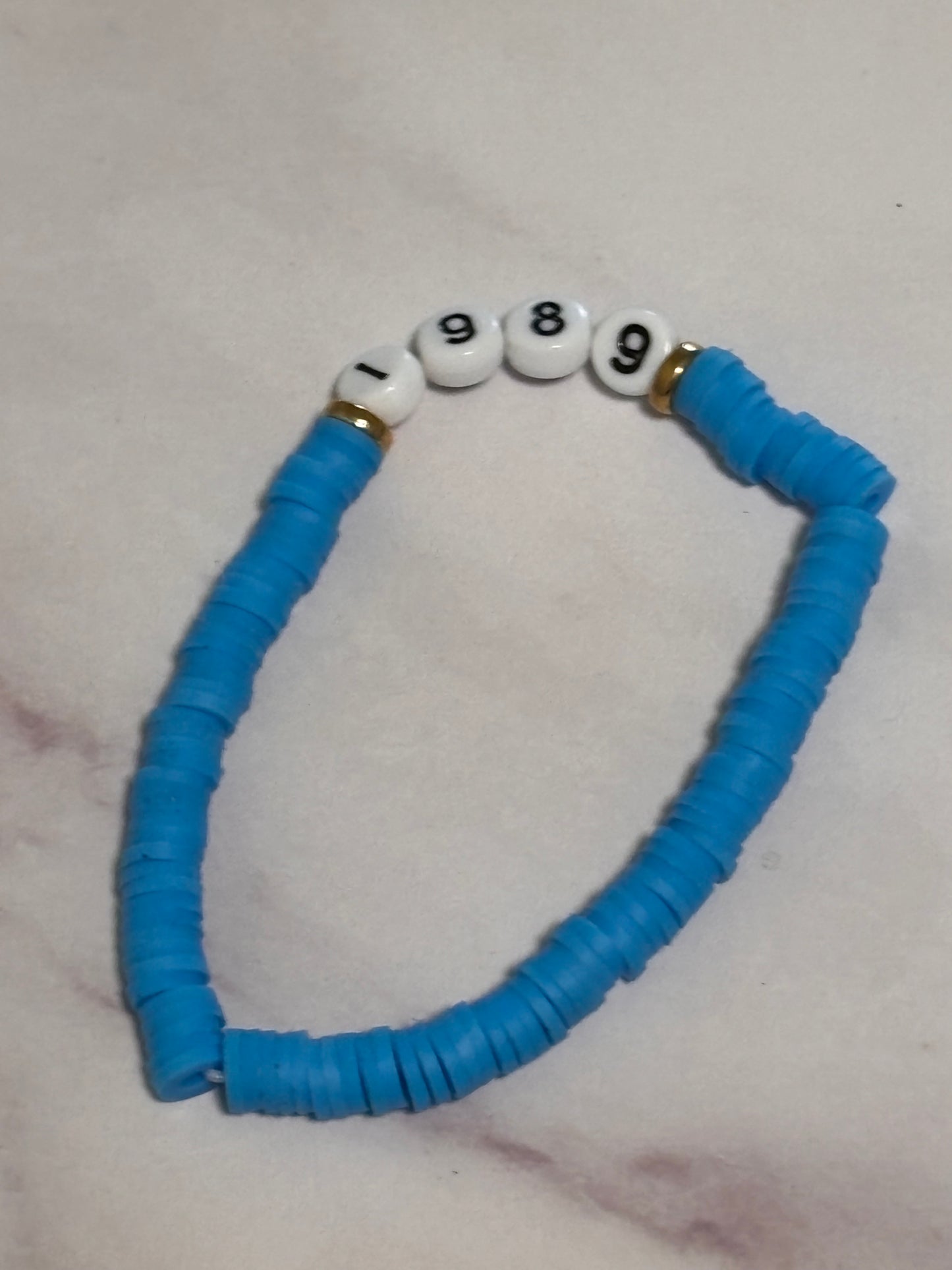 1989 Blue Heishi Word Bracelet 7 Inch Polymer Clay Gold White Letter Beads