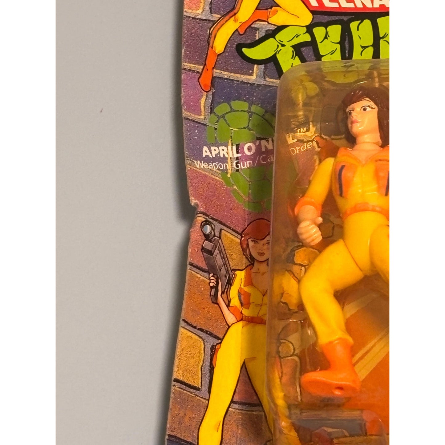 TMNT Teenage Mutant Ninja Turtles April O’Neil Orange Stripes Unpunched New 1990