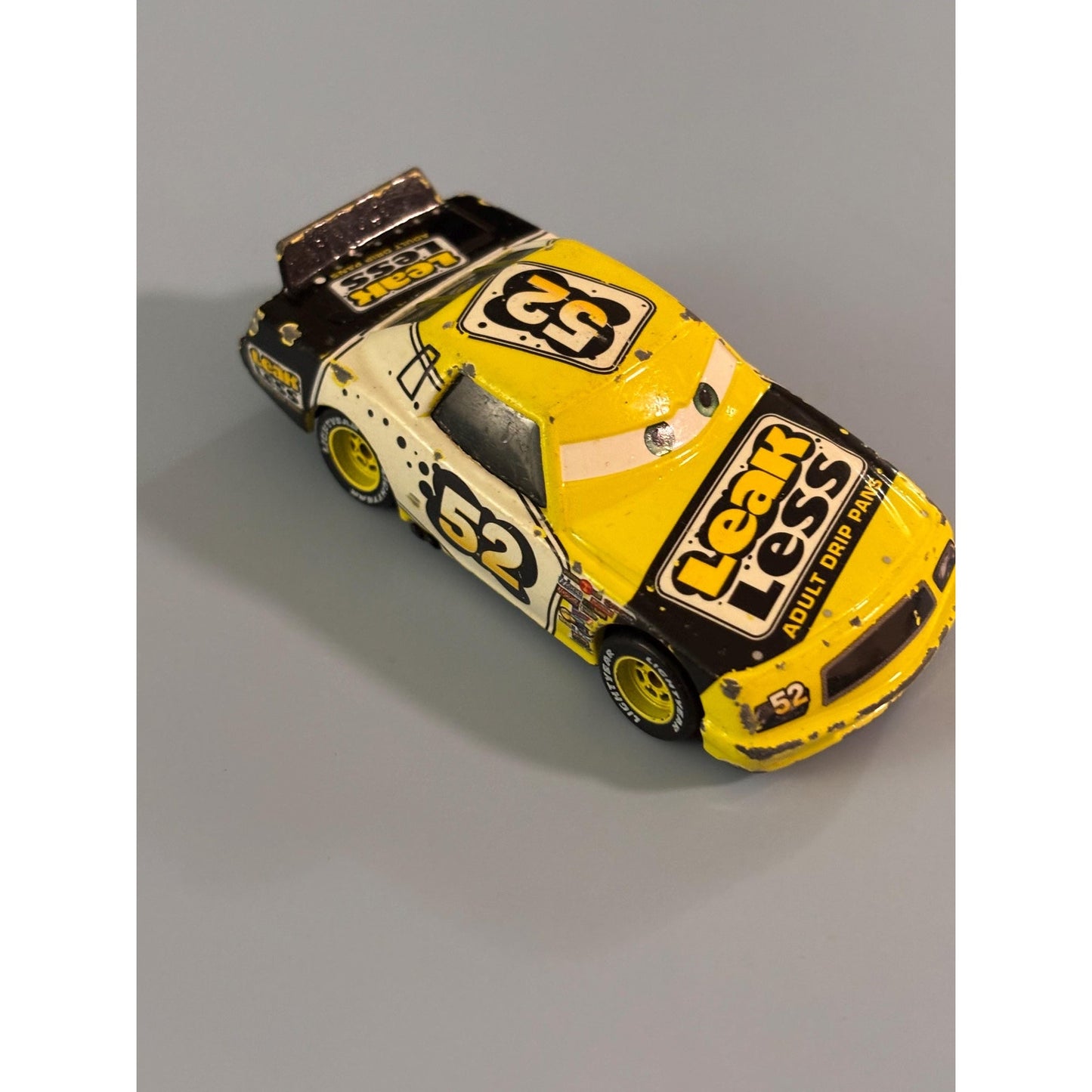 Disney Pixar Cars Claude Scruggs #52 Leak Less Yellow Die-Cast Vehicle
