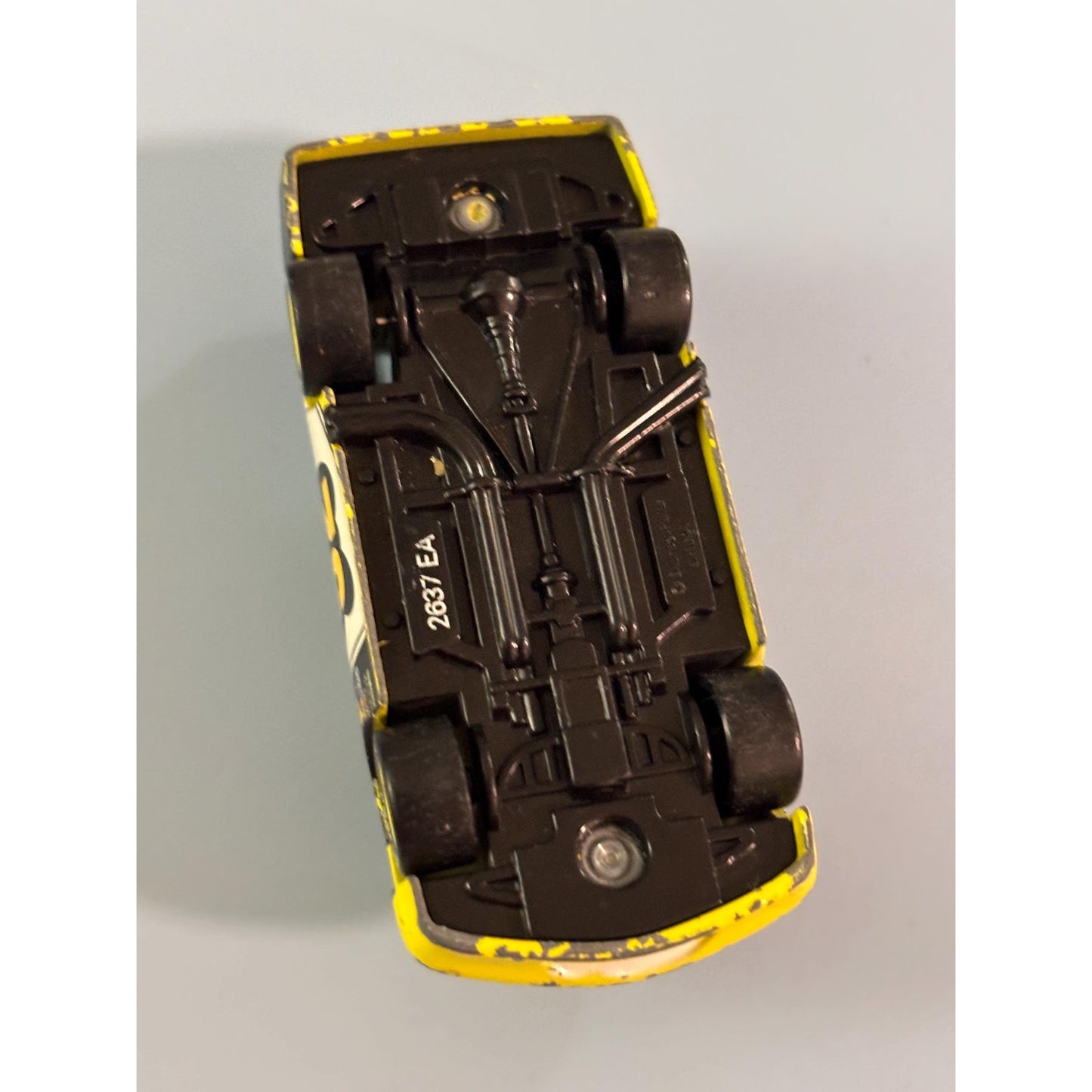 Disney Pixar Cars Claude Scruggs #52 Leak Less Yellow Die-Cast Vehicle