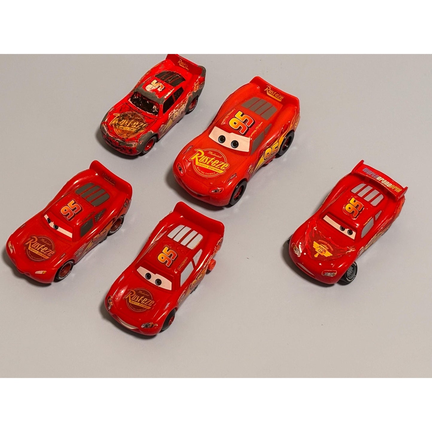 Lot of 5 Disney Pixar Cars 2 Lightning McQueen Diecast and Plastic Rust-eze Red