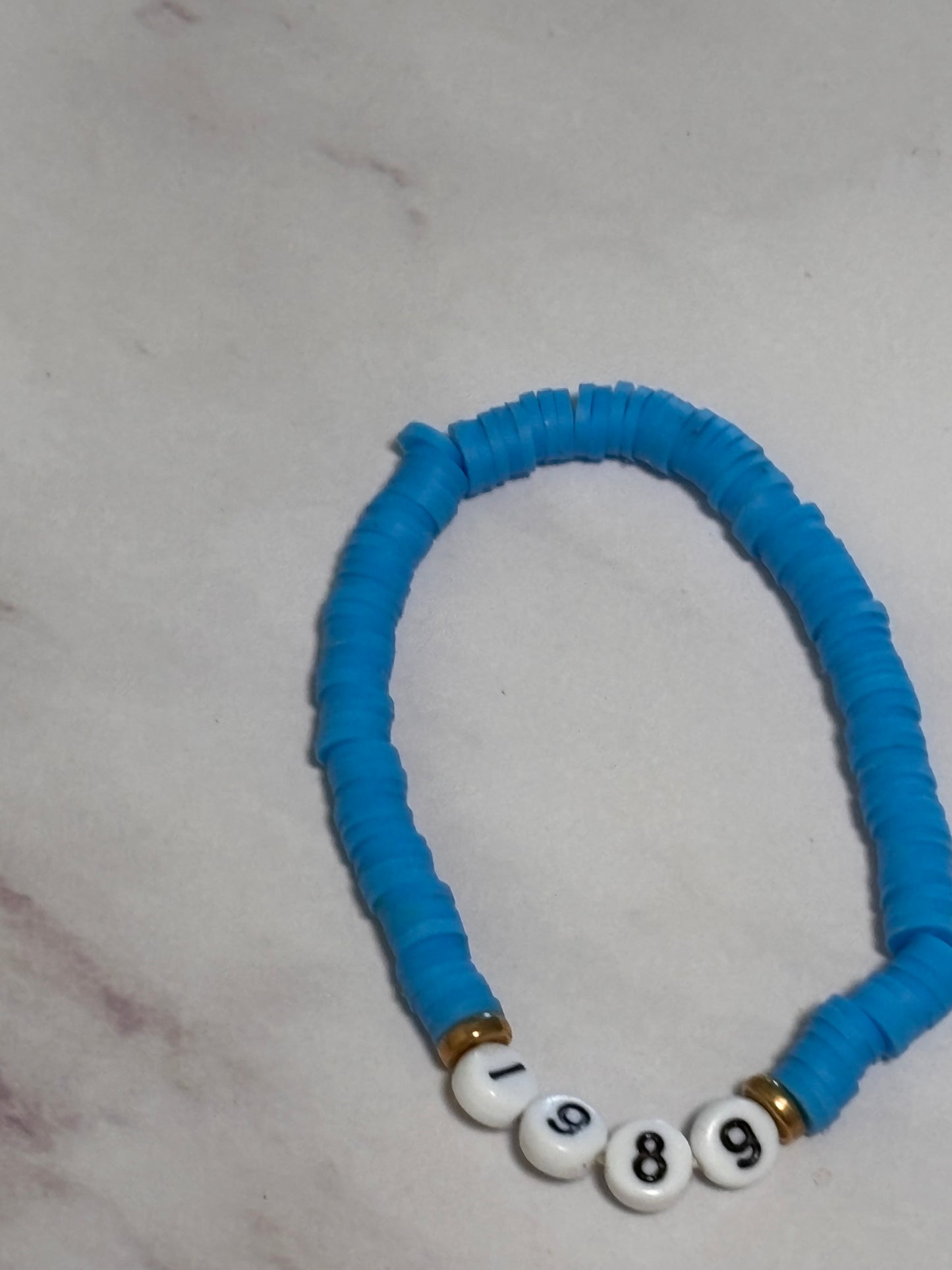 1989 Blue Heishi Word Bracelet 7 Inch Polymer Clay Gold White Letter Beads
